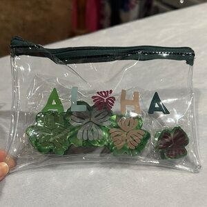 Small “Aloha” pouch and 2 green hair clips